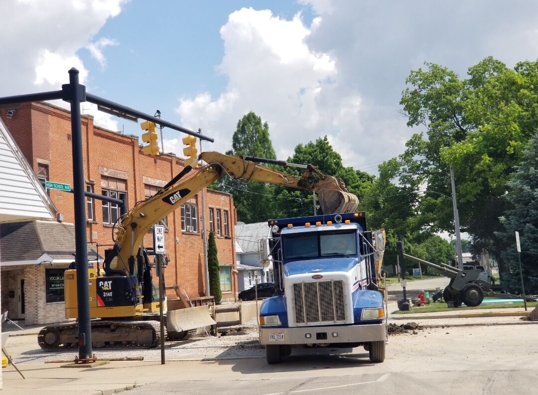 Heavy construction equipment at work in downtown Shelby